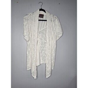 Guinevere Cardigan features a White Open-knit Crochet Pattern with Short Sleeves